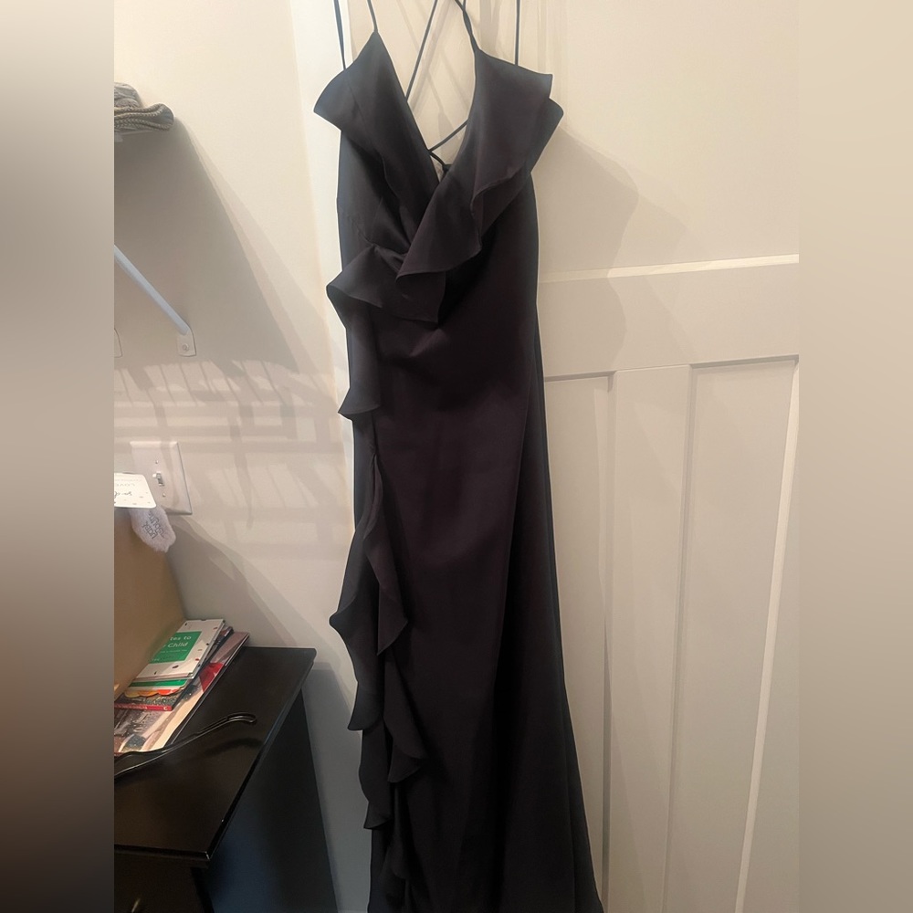 Navy blue maxi dress. Ruffled and strappy in the back. Slit up the front